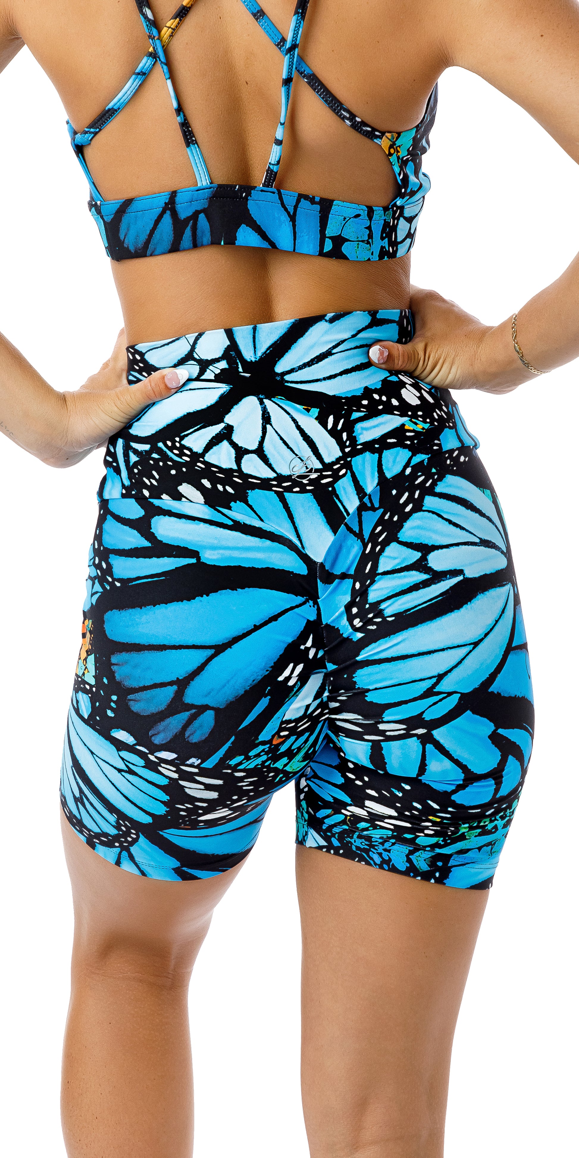 Rear view of girl in blue animal print JH Butterfly Eco Scrunch Bum Midi Shorts
