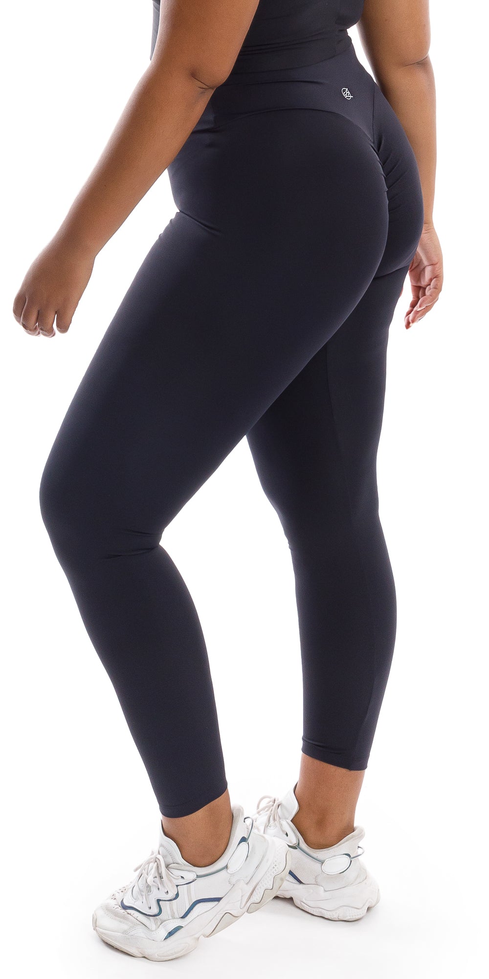 Side view of girl in black Midnight Body Luxe Scrunch Bum Leggings