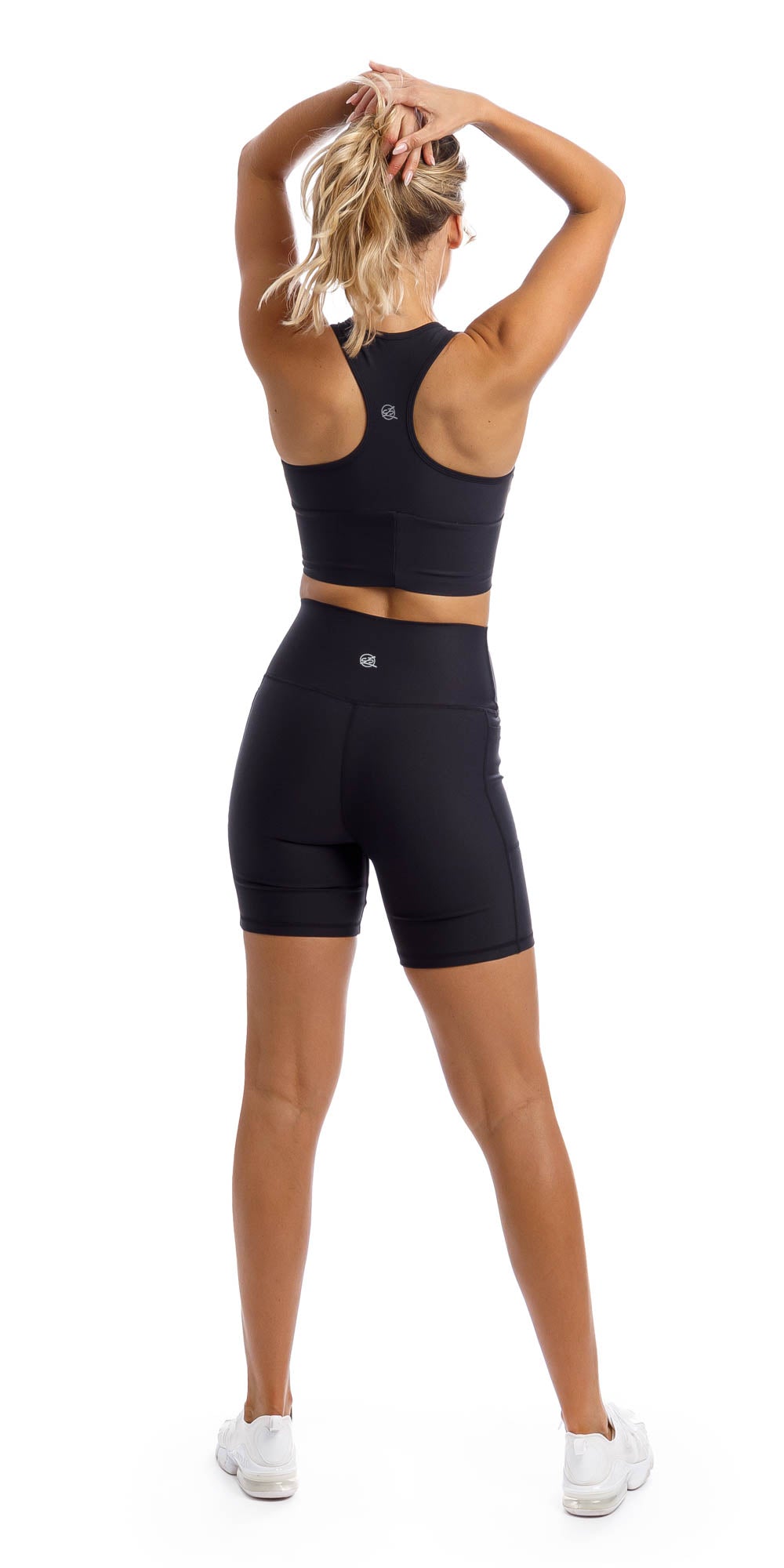 Rear view of girl wearing midnight racer bra & matching lined midi shorts