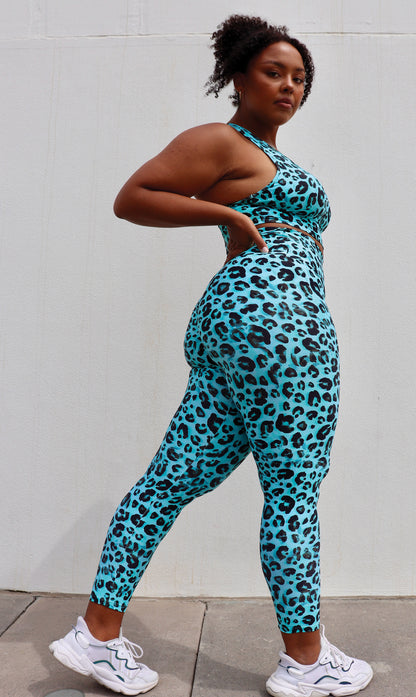 Side View: Lady wearing black and aqua leopard print ultra high waist scrunch bum leggings & matching racer back bra