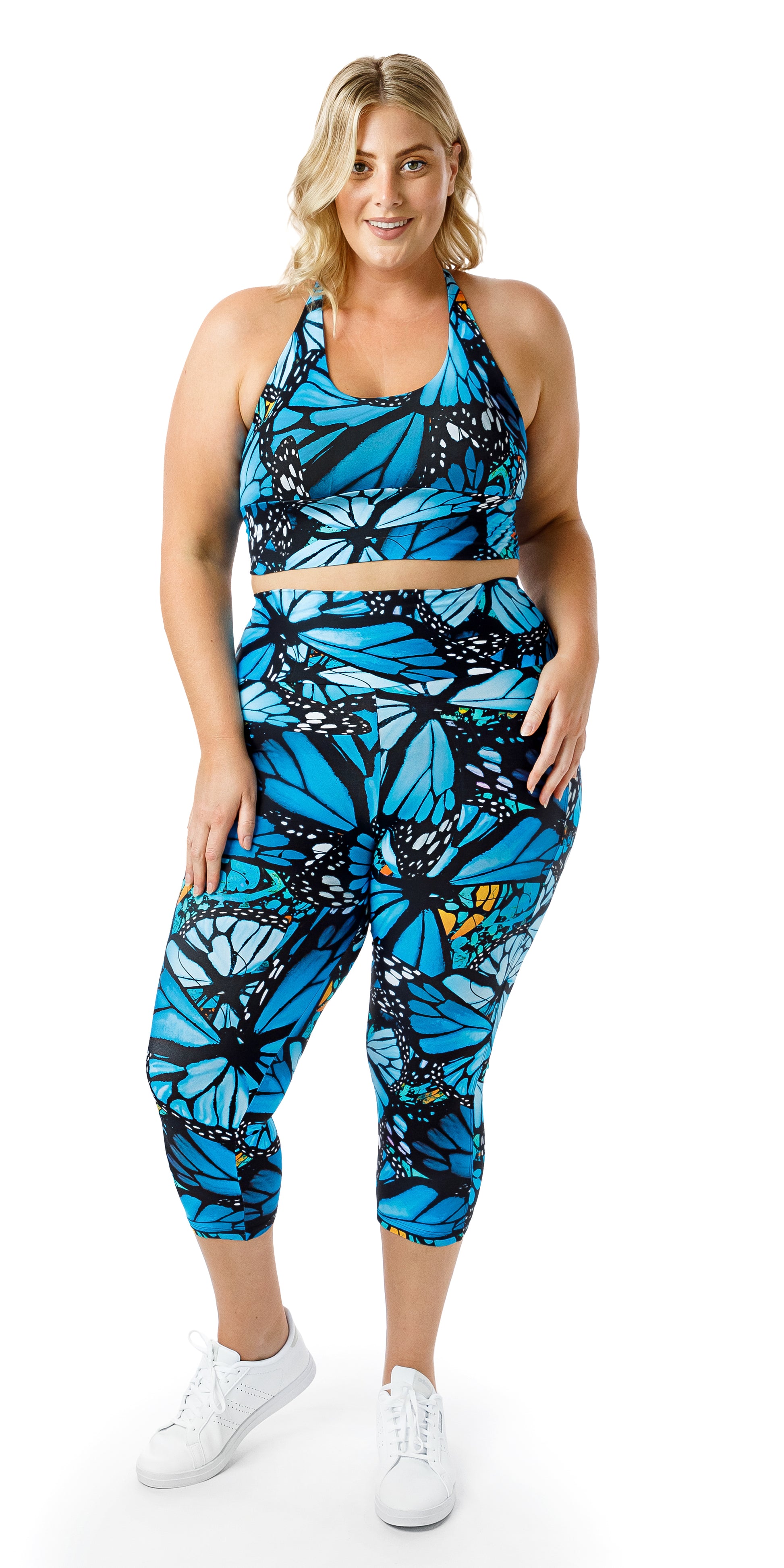 Full body front view of girl in blue animal print JH Butterfly Eco Capri Leggings with Pockets and matching bra