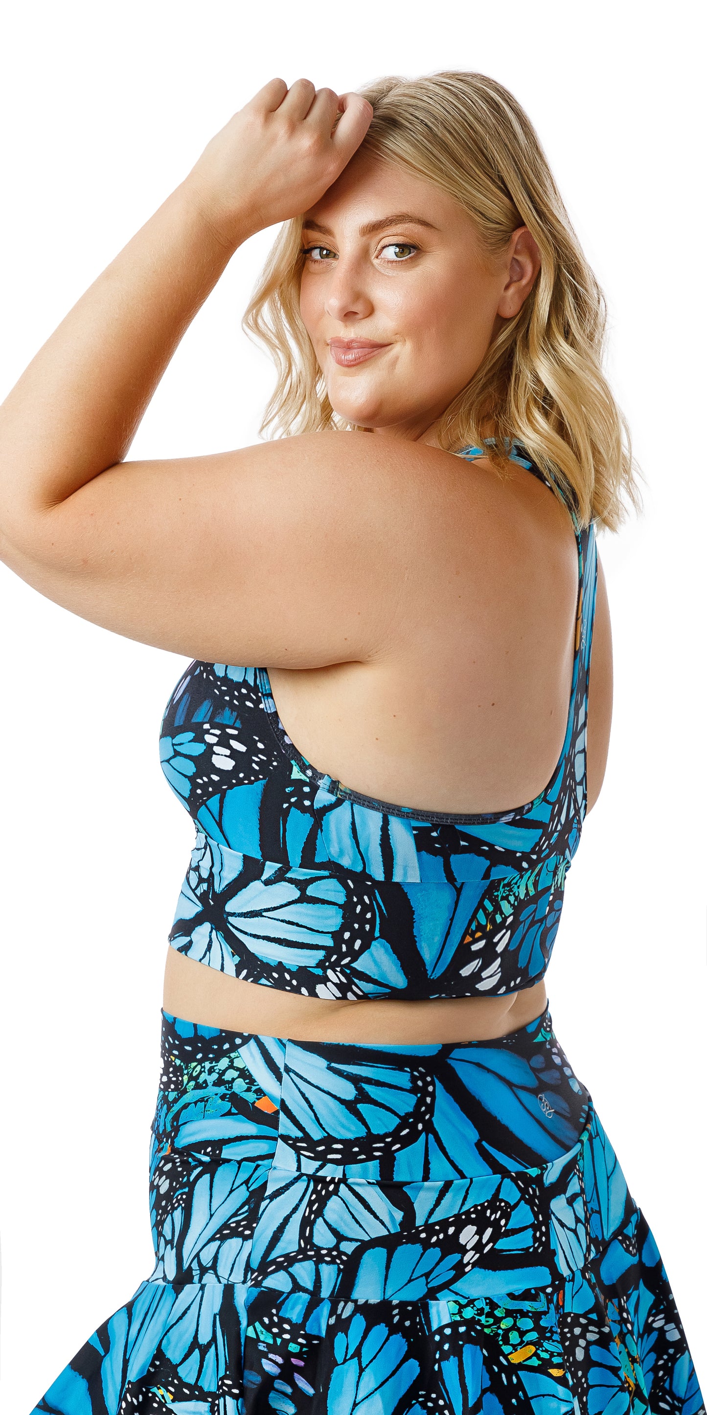 Side view of girl wearing blue animal print JH Butterfly Racer Back Bra putting her left hand on her forehead
