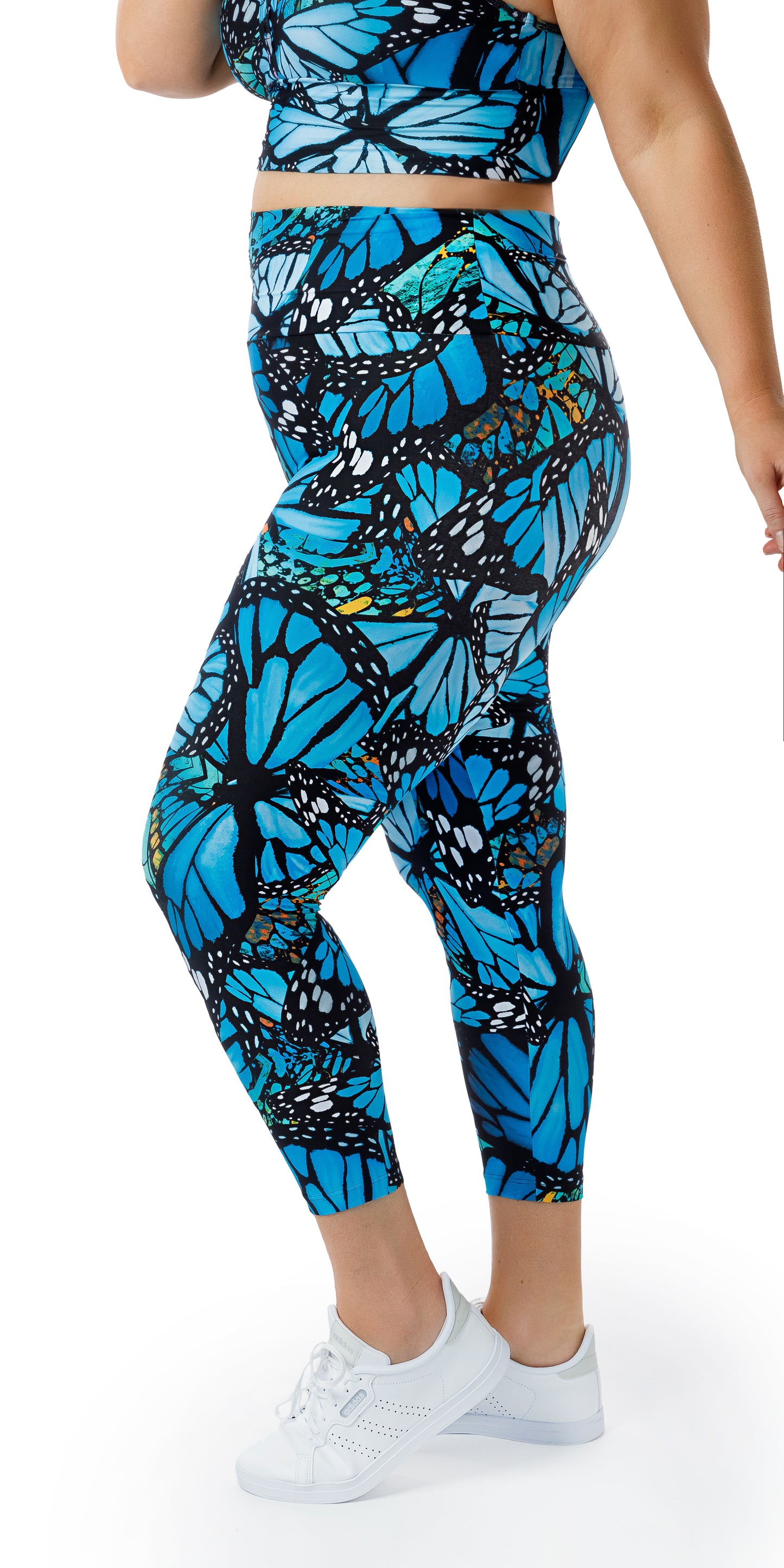 Side view of girl in blue animal print JH Butterfly Ultra High Waist 7/8 Leggings