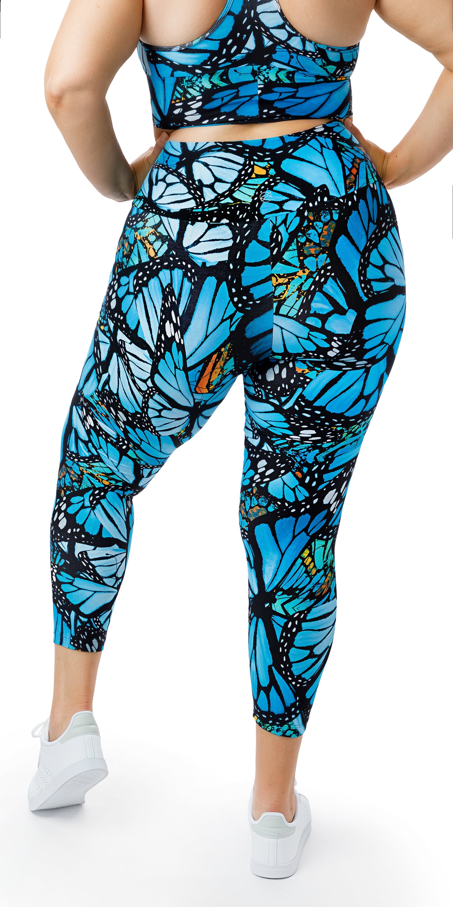 Rear view of girl in blue animal print JH Butterfly Ultra High Waist 7/8 Leggings putting both hands on her waist