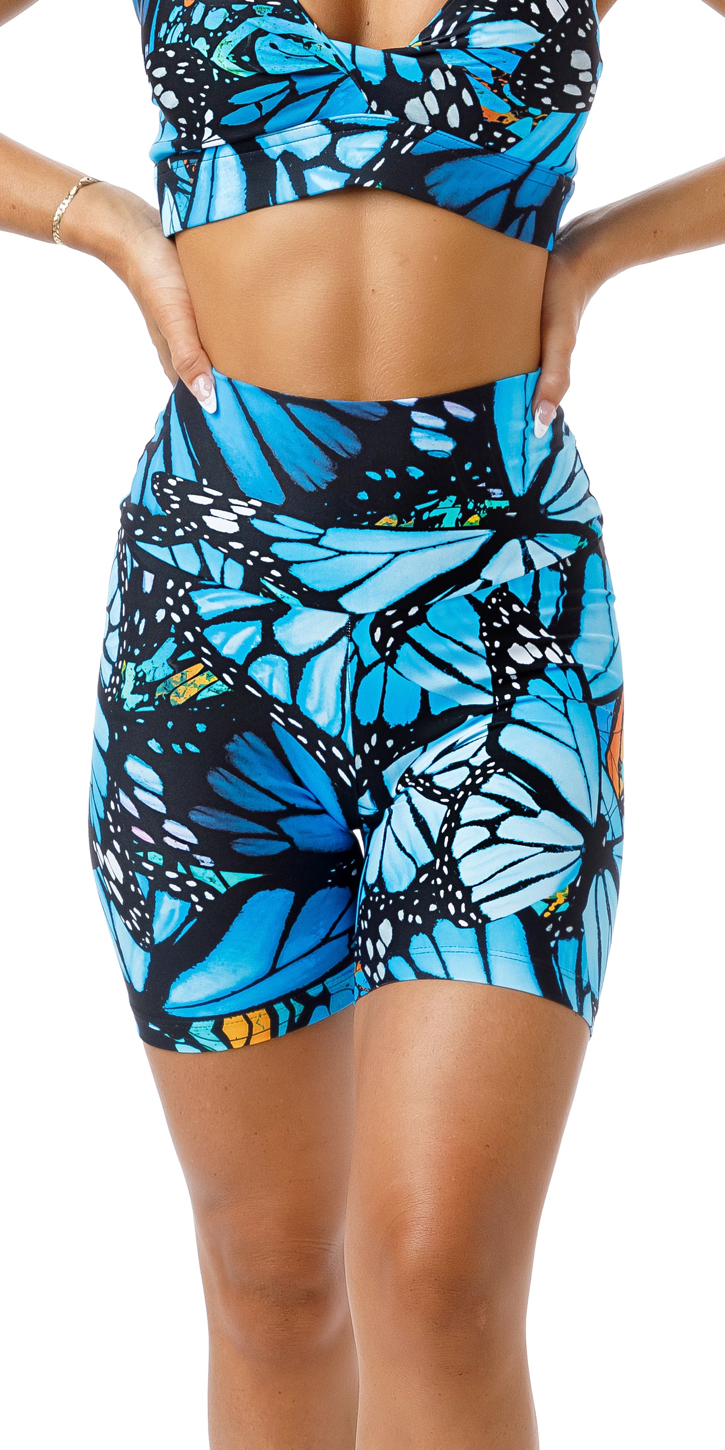Front view of girl in blue animal print JH Butterfly Eco Scrunch Bum Midi Shorts