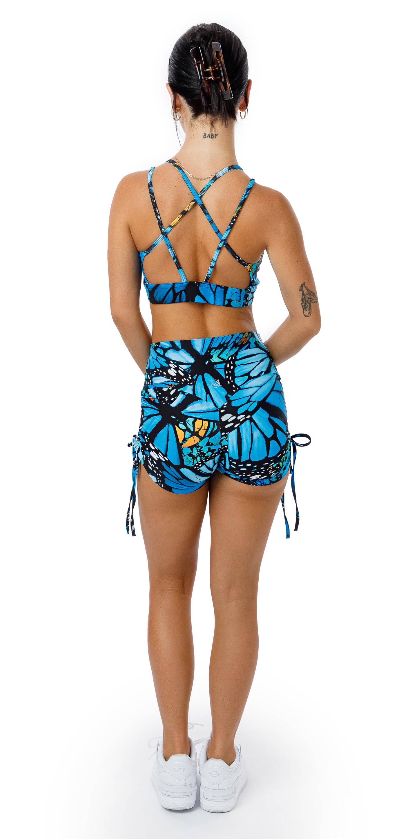 Full body rear view of girl in blue animal print JH Butterfly Eco Bootie Shorts and matching bra