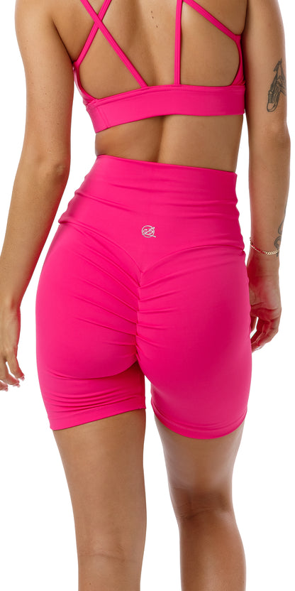 Rear view of girl in pink Candy Body Luxe Scrunch Bum Midi Shorts