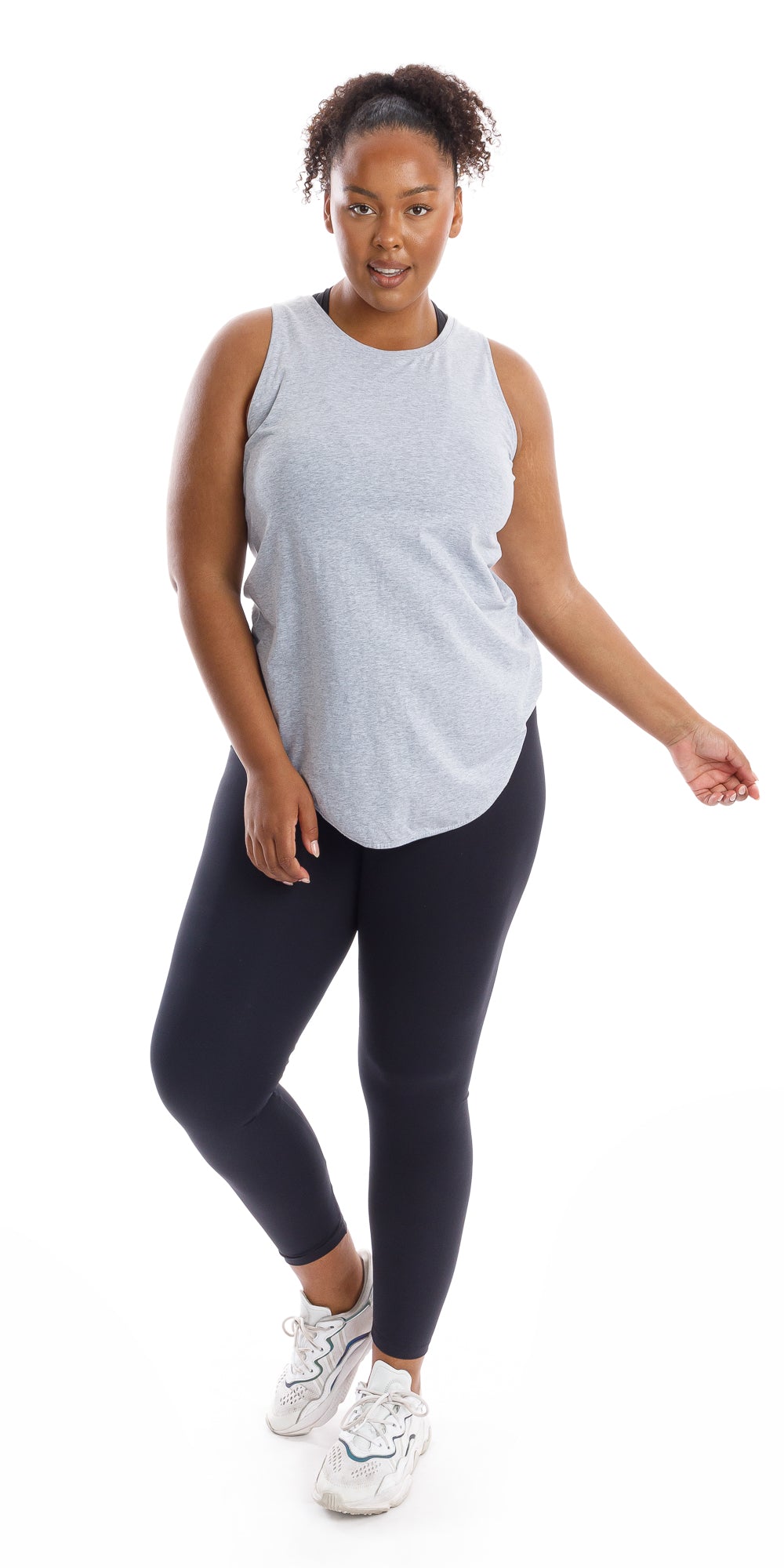Full body front view of girl in Grey Palm Beach Tank and black leggings swaying her hands