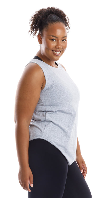 Side view of smiling girl in Grey Palm Beach Tank and black leggings
