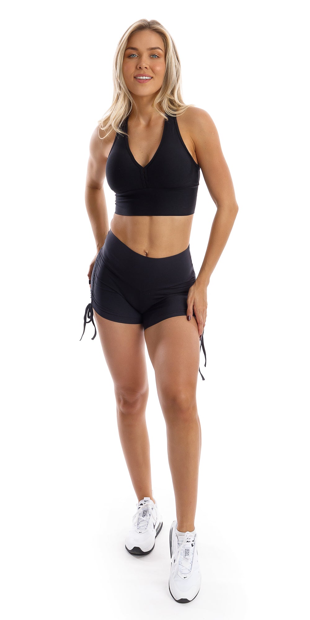 Full body front view of girl wearing black Midnight Eco Bootie Shorts and matching bra