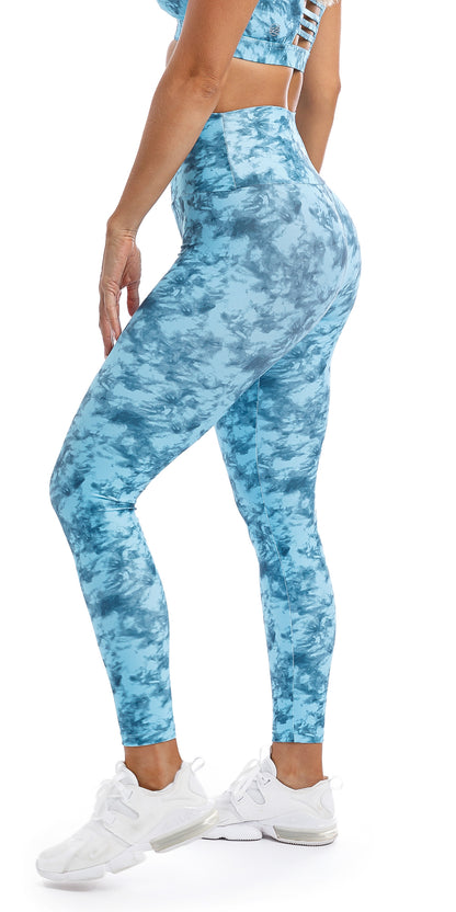 Side view of girl wearing blue tie dye blue crush print ultra high waist leggings & matching momentum bra
