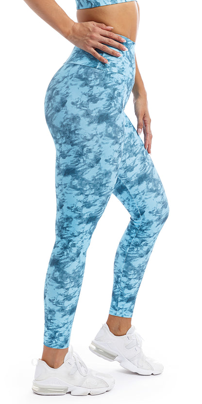Side view of girl wearing blue tie dye blue crush print ultra high waist leggings & matching momentum bra
