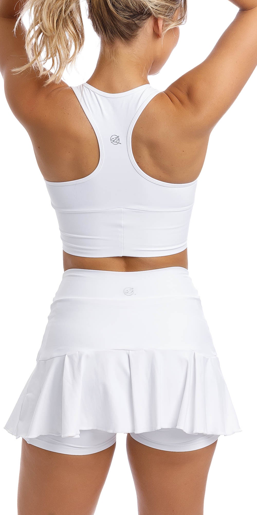 Rear view of girl wearing white racer bra & matching skort