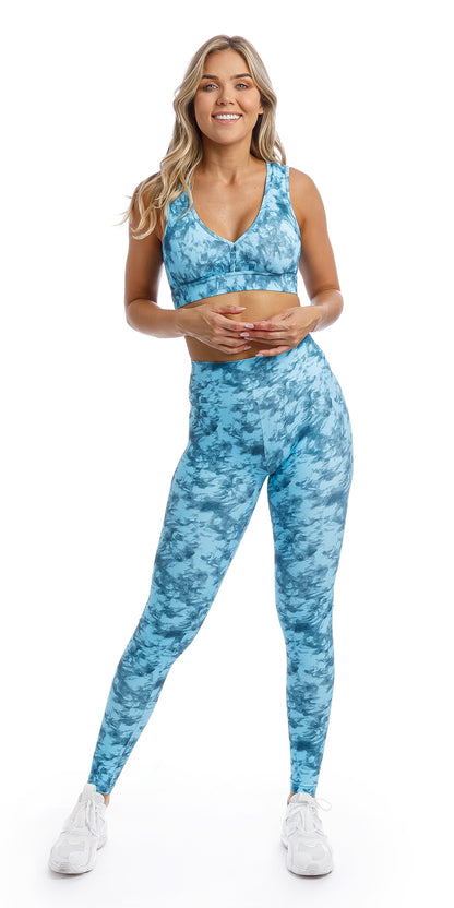 Girl in blue tie dye blue crush print high waist extra long leggings & matching infinity bra