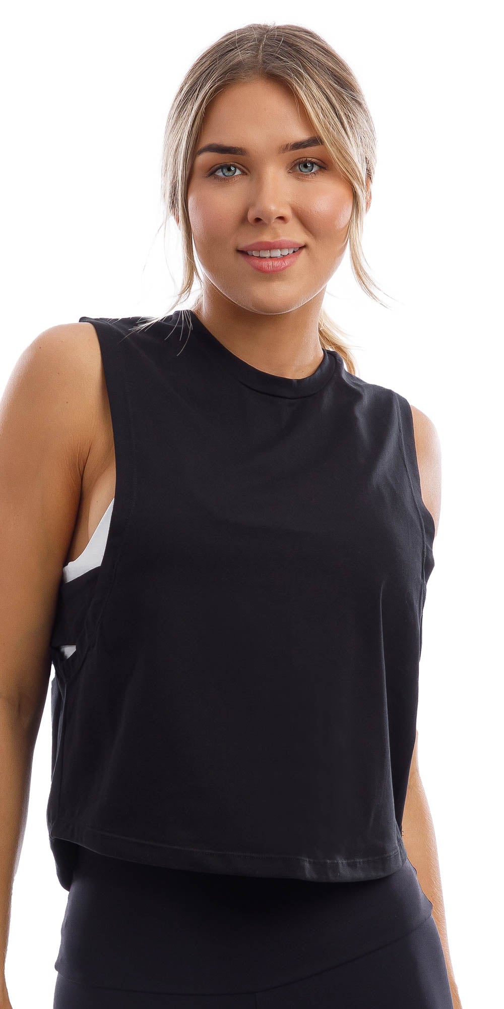 Girl wearing cropped midnight Burleigh Tank with side straps & matching ultra high waist midnight leggings