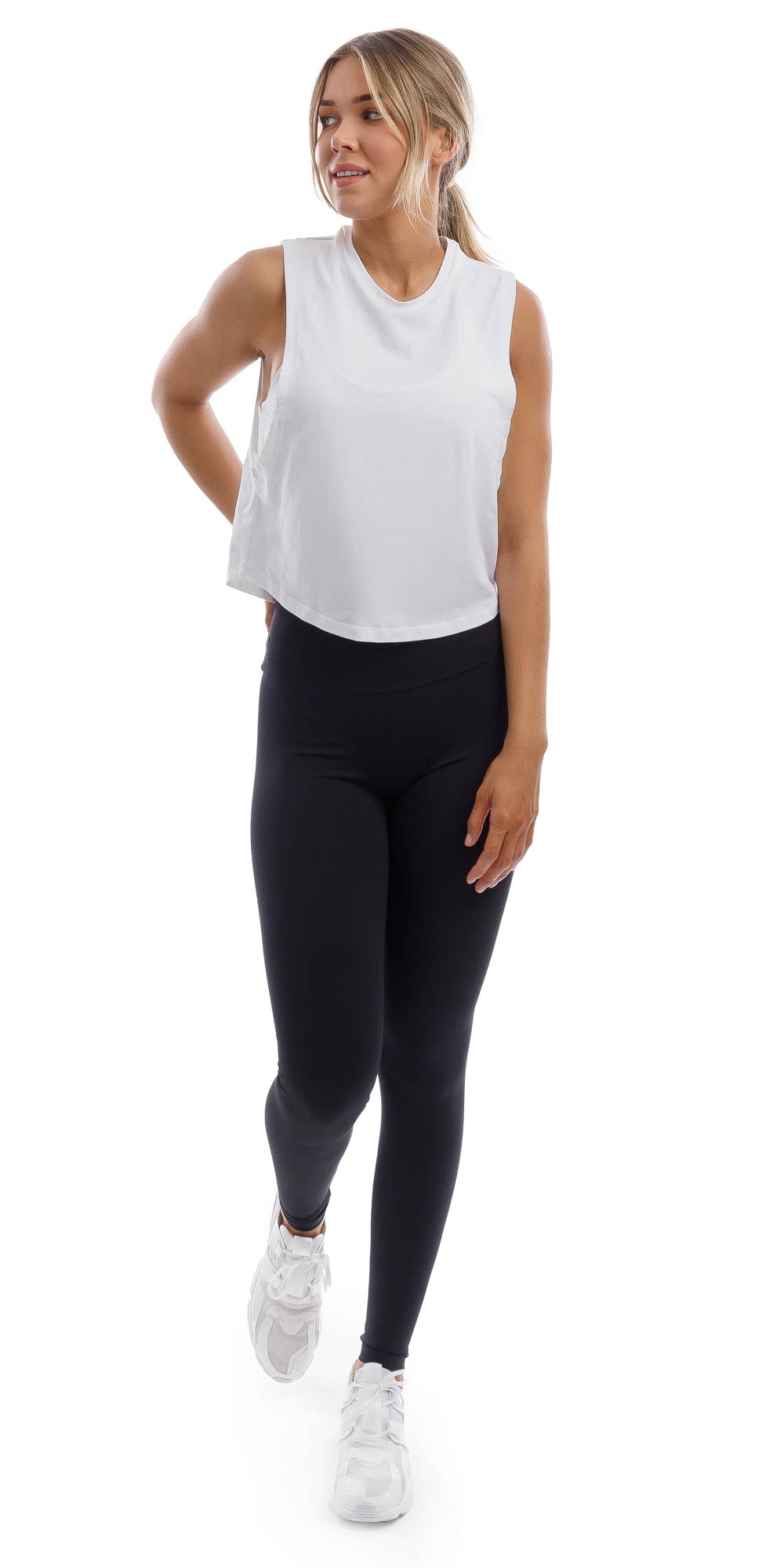 Girl wearing cropped white Burleigh Tank with side straps & matching ultra high waist midnight leggings