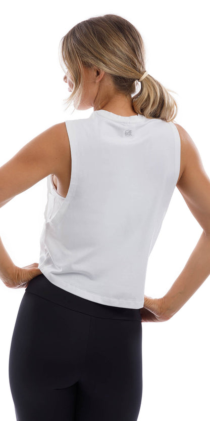 Rear view of girl wearing cropped white Burleigh Tank with side straps & matching ultra high waist midnight leggings