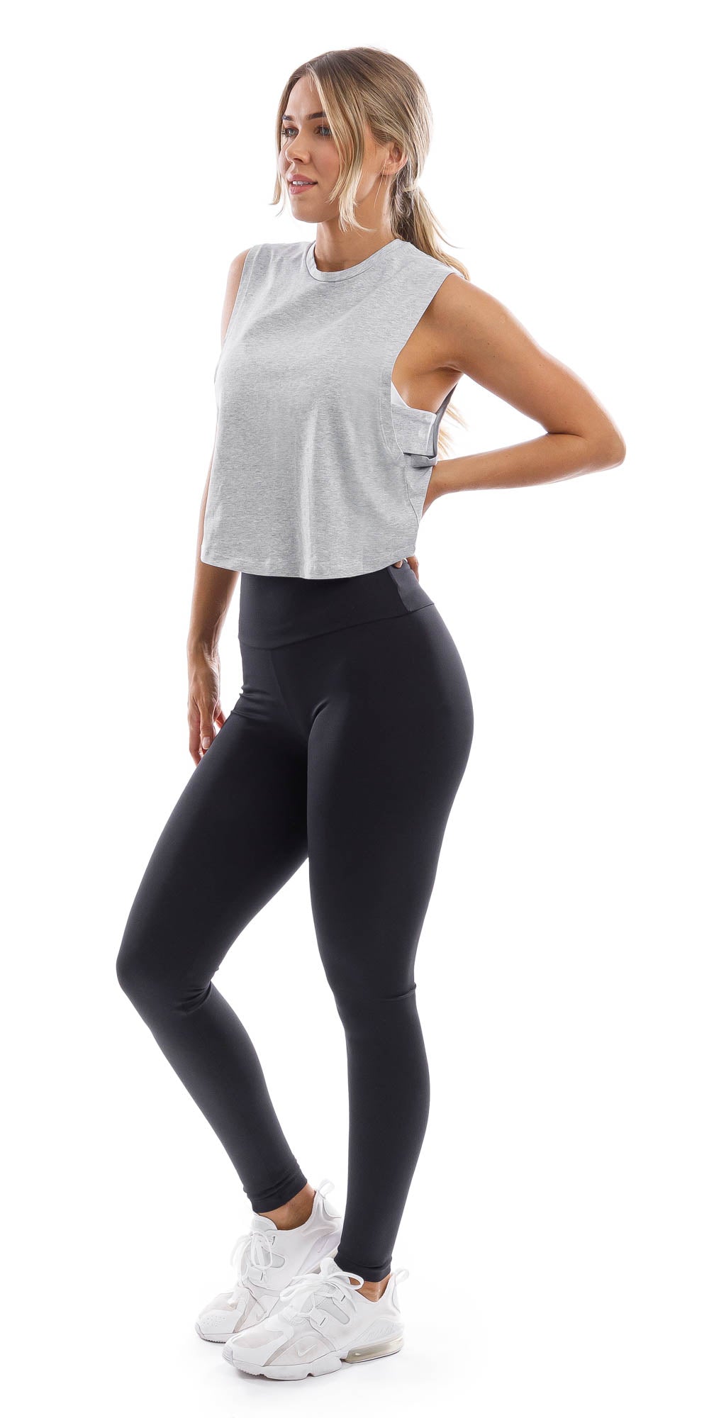 Girl with hand on hip wearing cropped grey Burleigh Tank with side straps & ultra high waist midnight leggings