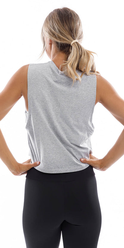 Rear view of girl wearing cropped grey Burleigh Tank with side straps & ultra high waist midnight leggings