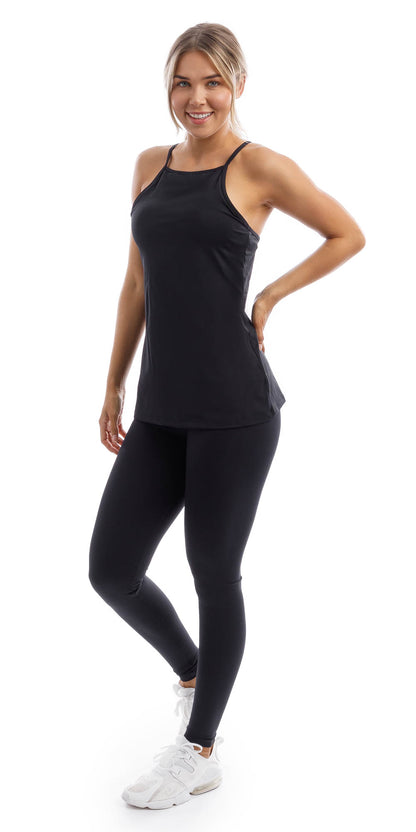 Full body front view of girl in black Midnight Performance Tank and matching leggings putting one hand on waist