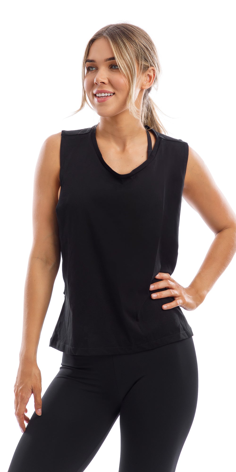 Girl with hand on hip wearing midnight Lennox Tank with open cut out back & matching ultra high waist leggings