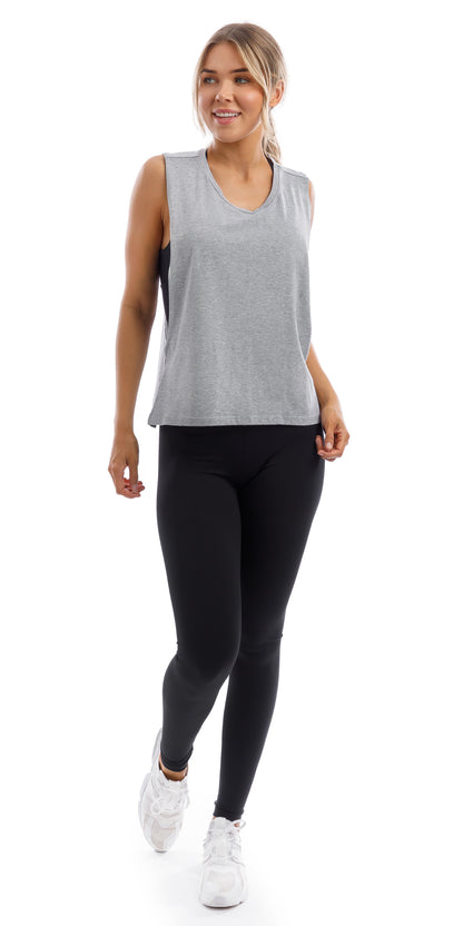 Girl in grey Lennox Tank with open cut out back & ultra high waist midnight leggings
