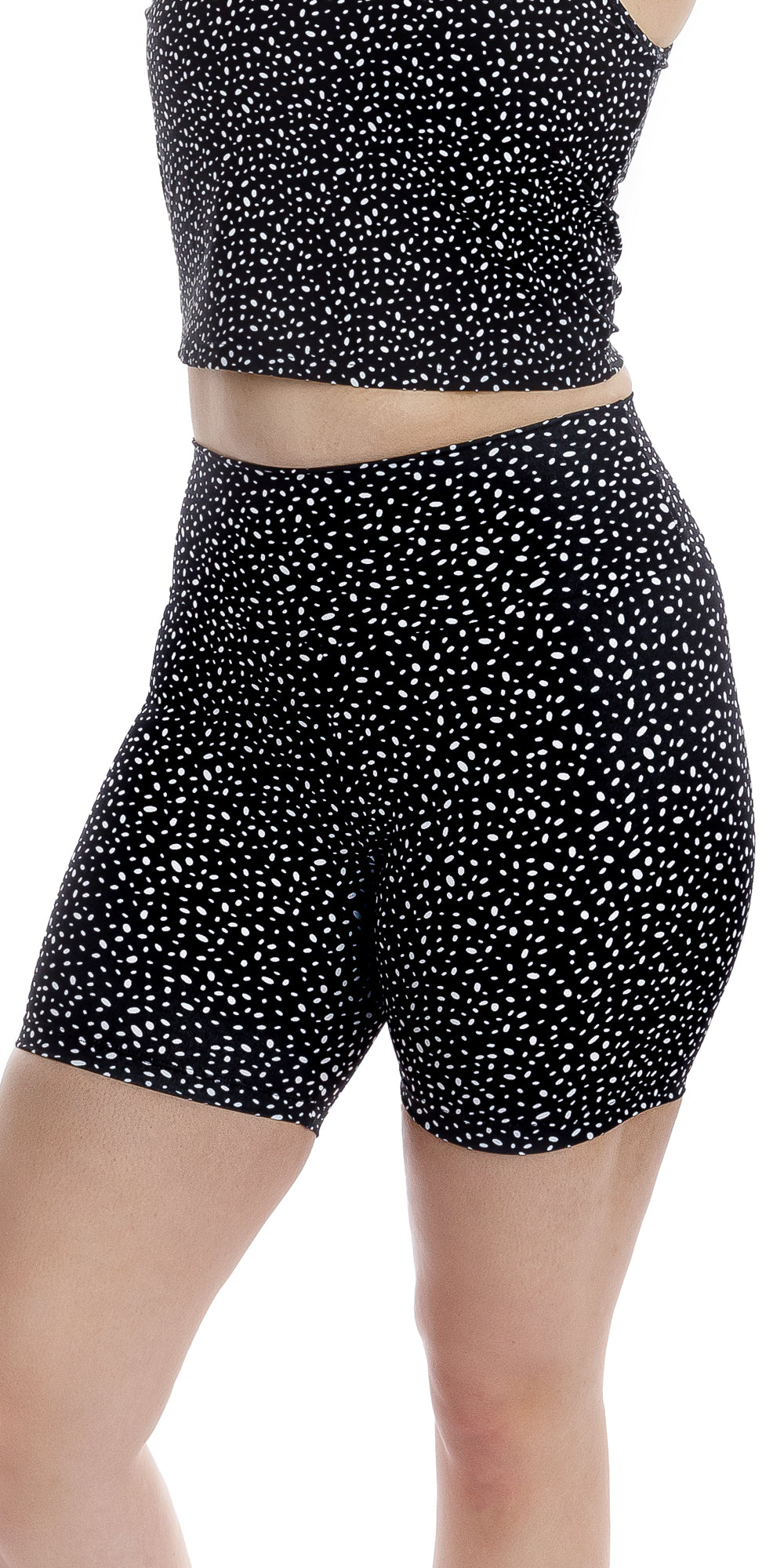 Front view of girl wearing black Star Dust Body Luxe Midi Shorts and matching top