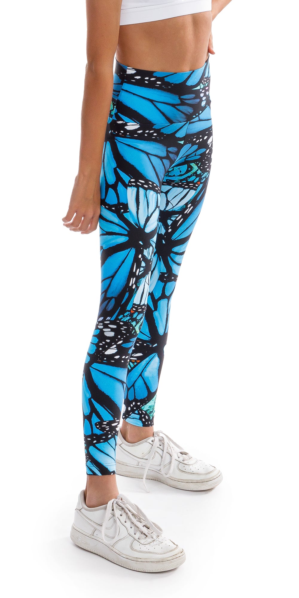 Side view bottom part of girl teenager in blue and black animal print Tween JH Butterfly Ultra High Waist 7/8 Leggings putting left hand on waist