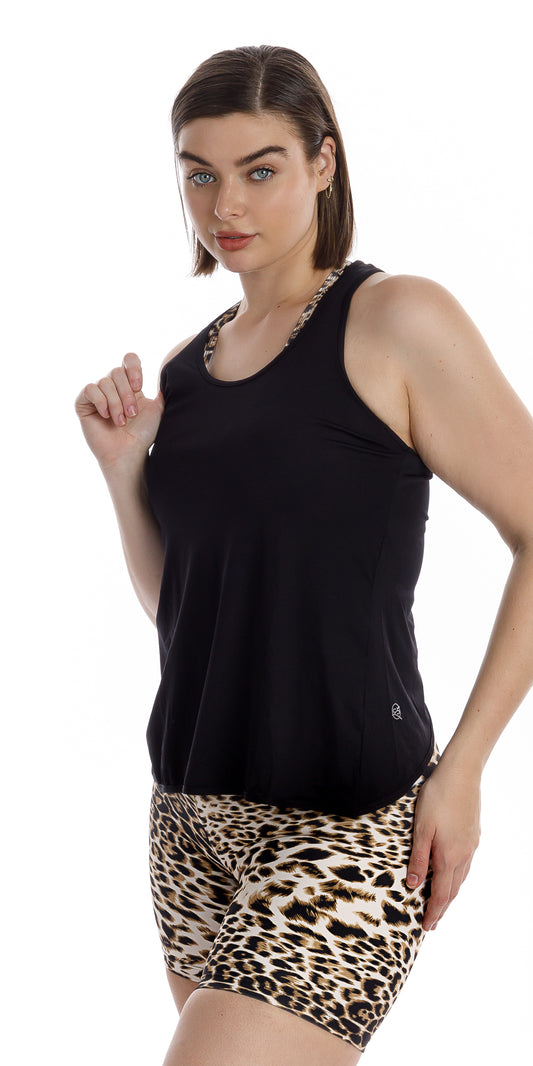 Side view of girl in black Midnight Miami Tank and animal print bottoms