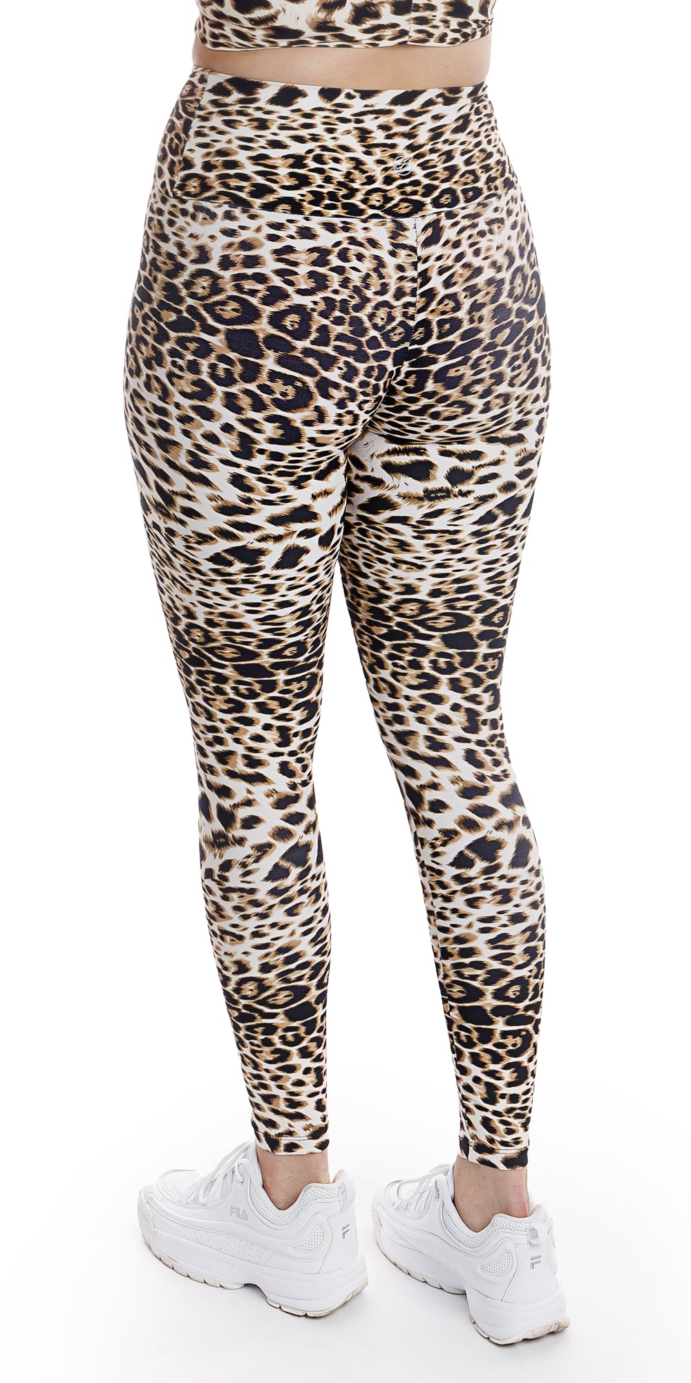 Rear view bottom part of lady in animal print White Cheetah Ultra High Waist Leggings and white shoes