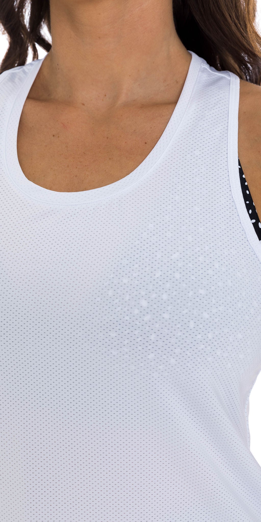 Front view close up shot of top part of lady in sleeveless White Meshed Racer Back Tank