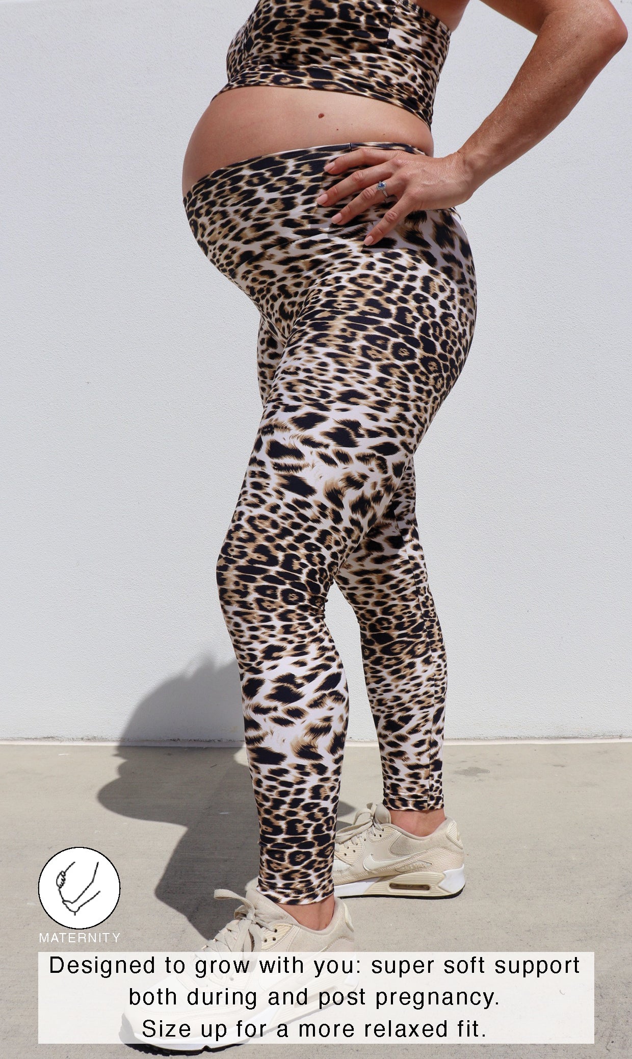 Pregnant lady in ultra high waist, brown and white cheetah print leggings & matching racer back bra